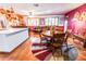 Bright dining area with wooden table and chairs, near kitchen at 9635 W Spanish Moss Ln, Sun City, AZ 85373