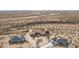 Aerial view of a house and surrounding desert landscape, showing a new home under construction at 1065 Buckboard Trl, Wickenburg, AZ 85390