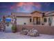 Inviting entrance to a lovely home at sunset at 1065 Buckboard Trl, Wickenburg, AZ 85390