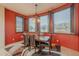 Bright dining room with red walls and mountain views at 10751 E Cactus View Cir, Gold Canyon, AZ 85118