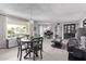 Living room features a piano, dining table and grey walls at 11815 N Rio Vista Dr, Sun City, AZ 85351