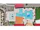 Drone view of community pool, featuring various pools and a playground area at 12157 E Aster Ln, Florence, AZ 85132