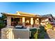 Backyard patio with seating area, hot tub, and grill at 17587 N Rainbow Cir, Surprise, AZ 85374