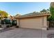 Single story home with landscaped yard and two-car garage at 17587 N Rainbow Cir, Surprise, AZ 85374