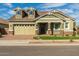 Two-story craftsman home with attached garage at 22934 E Carriage Way, Queen Creek, AZ 85142