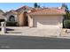 One-story house with Spanish tile roof and attached garage at 26002 S Boxwood Dr, Sun Lakes, AZ 85248