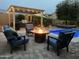 Outdoor oasis with a pool, fire pit, and pergola at 2949 N Acacia Way, Buckeye, AZ 85396