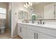 Modern bathroom with double vanity, shower, and toilet at 2949 N Acacia Way, Buckeye, AZ 85396