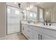 Modern bathroom with double vanity and large shower at 2949 N Acacia Way, Buckeye, AZ 85396