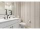 Clean bathroom with a single vanity and toilet at 2949 N Acacia Way, Buckeye, AZ 85396