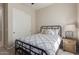 Cozy bedroom with a double bed, nightstand, and closet at 2949 N Acacia Way, Buckeye, AZ 85396