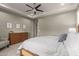 Spacious bedroom with a king-size bed and built in dresser at 2949 N Acacia Way, Buckeye, AZ 85396