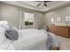 Main bedroom with a dresser and large bed at 2949 N Acacia Way, Buckeye, AZ 85396