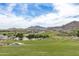 Expansive golf course with scenic mountain views at 2949 N Acacia Way, Buckeye, AZ 85396