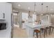 Modern kitchen with white shaker cabinets, stainless steel appliances, and a large island at 2949 N Acacia Way, Buckeye, AZ 85396