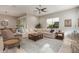 Bright living room with large sectional sofa and ample natural light at 2949 N Acacia Way, Buckeye, AZ 85396