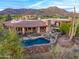 Aerial view of the house, highlighting its design and surrounding landscape at 41731 N Stone Cutter Dr, Scottsdale, AZ 85262