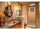 Rustic bathroom with unique sink and walk-in shower at 41731 N Stone Cutter Dr, Scottsdale, AZ 85262