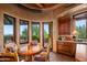 Charming kitchen nook with views and rustic wooden table at 41731 N Stone Cutter Dr, Scottsdale, AZ 85262