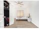 Bedroom with ceiling fan and large closet at 5038 W Echo Ln, Glendale, AZ 85302