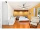 Bright bedroom with wood floors and ceiling fan at 5038 W Echo Ln, Glendale, AZ 85302