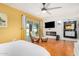 Main bedroom with fireplace and access to patio at 5038 W Echo Ln, Glendale, AZ 85302