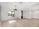 Open dining room with modern chandelier and hardwood floors at 6234 E Blanche Dr, Scottsdale, AZ 85254