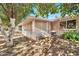View of home's back, showing patio and trees at 10205 W Royal Oak Rd, Sun City, AZ 85351