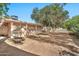 Spacious backyard, offering a tranquil setting with mature trees and plenty of room at 10205 W Royal Oak Rd, Sun City, AZ 85351