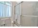 Bathroom with shower stall, window, and towels at 10205 W Royal Oak Rd, Sun City, AZ 85351