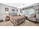 Bright bedroom featuring a comfortable bed and window coverings at 10205 W Royal Oak Rd, Sun City, AZ 85351