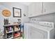 Laundry room with washer, dryer, and additional storage at 10205 W Royal Oak Rd, Sun City, AZ 85351
