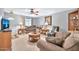 Living room with a couch, recliner, and wooden coffee table at 10205 W Royal Oak Rd, Sun City, AZ 85351
