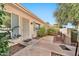 Small patio with seating area next to the house entrance at 10205 W Royal Oak Rd, Sun City, AZ 85351