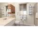Clean bathroom with a single sink and shower/tub combo at 10728 W Cheryl Dr, Sun City, AZ 85351