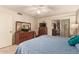 Bright bedroom with large window and wood dresser at 10728 W Cheryl Dr, Sun City, AZ 85351