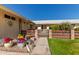 Front entry with walkway, landscaping, and a decorative gate at 10728 W Cheryl Dr, Sun City, AZ 85351