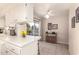 Kitchen features breakfast bar and sliding door to patio at 10728 W Cheryl Dr, Sun City, AZ 85351