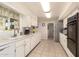 Bright eat-in kitchen with ample cabinetry and modern appliances at 10728 W Cheryl Dr, Sun City, AZ 85351