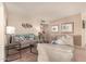 Living room with two sofas and decorative wall art at 10728 W Cheryl Dr, Sun City, AZ 85351