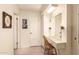Vanity area with large mirror and plenty of storage at 10728 W Cheryl Dr, Sun City, AZ 85351