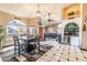 Bright dining area with a table for four and wet bar at 10773 S Xavier Ct, Goodyear, AZ 85338