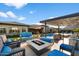 Backyard oasis with fire pit and lounge seating at 11946 E Cavedale Dr, Scottsdale, AZ 85262