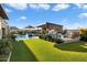 Landscaped backyard with pool, spa, and covered patio at 11946 E Cavedale Dr, Scottsdale, AZ 85262