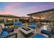 Backyard oasis with fire pit and lounge seating at 11946 E Cavedale Dr, Scottsdale, AZ 85262