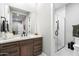 Modern bathroom with walk-in shower and wood vanity at 11946 E Cavedale Dr, Scottsdale, AZ 85262