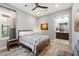 Guest bedroom with ensuite bathroom and wood flooring at 11946 E Cavedale Dr, Scottsdale, AZ 85262
