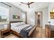 Guest bedroom with wood frame bed, mid-century modern decor, and ample closet space at 11946 E Cavedale Dr, Scottsdale, AZ 85262