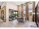 Bright dining area with sliding glass doors and stylish light fixture at 11946 E Cavedale Dr, Scottsdale, AZ 85262