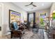 Bright home office features built-in desk, comfortable seating, and backyard access at 11946 E Cavedale Dr, Scottsdale, AZ 85262